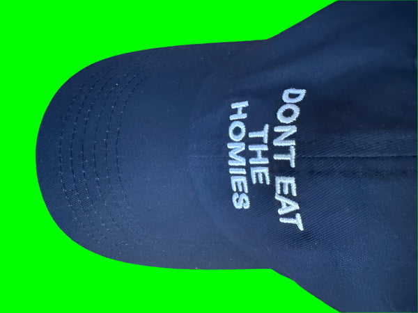 Flat lay top view Don't Eat The Homies blue black baseball cap sustainable thrifted headwear