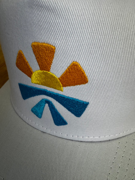 White baseball cap detail showing water resistant material and premium stitching quality