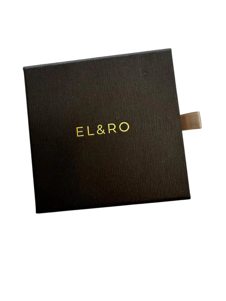 Pair of gold vermeil pearl huggie earrings displayed together