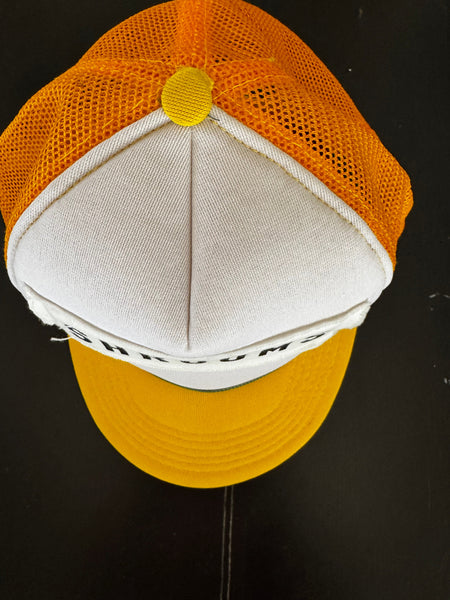 Top view of sustainable yellow baseball cap showing design details