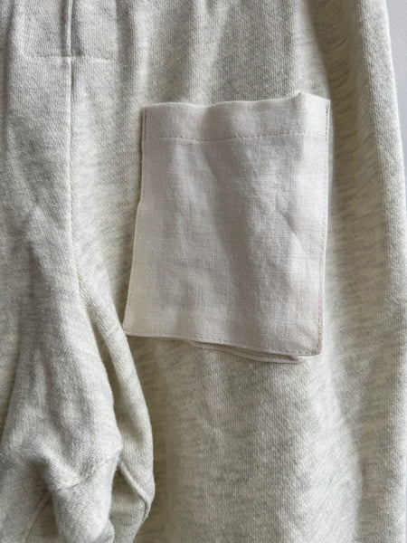 You The Brave grey sweatpants back pocket detail with linen accent